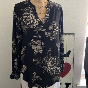 Beautiful black, long sleeve blouse with beige flowers.